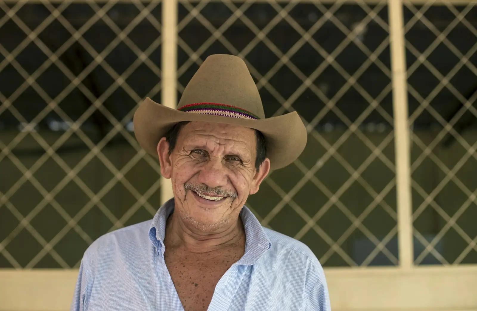 Smiling Australian farmer in a wide-brimmed hat