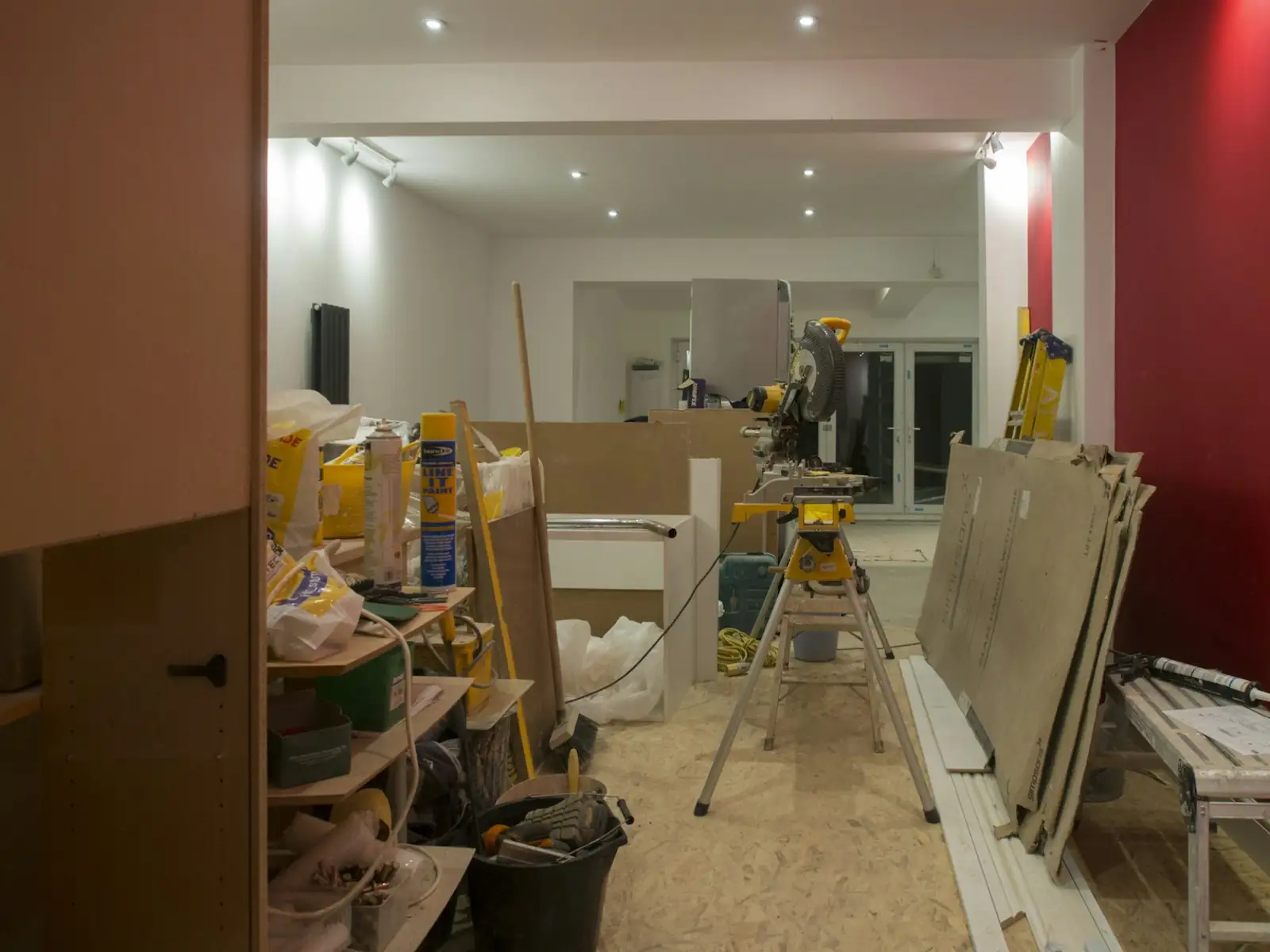 Shop fit-out in progress with timber and tools