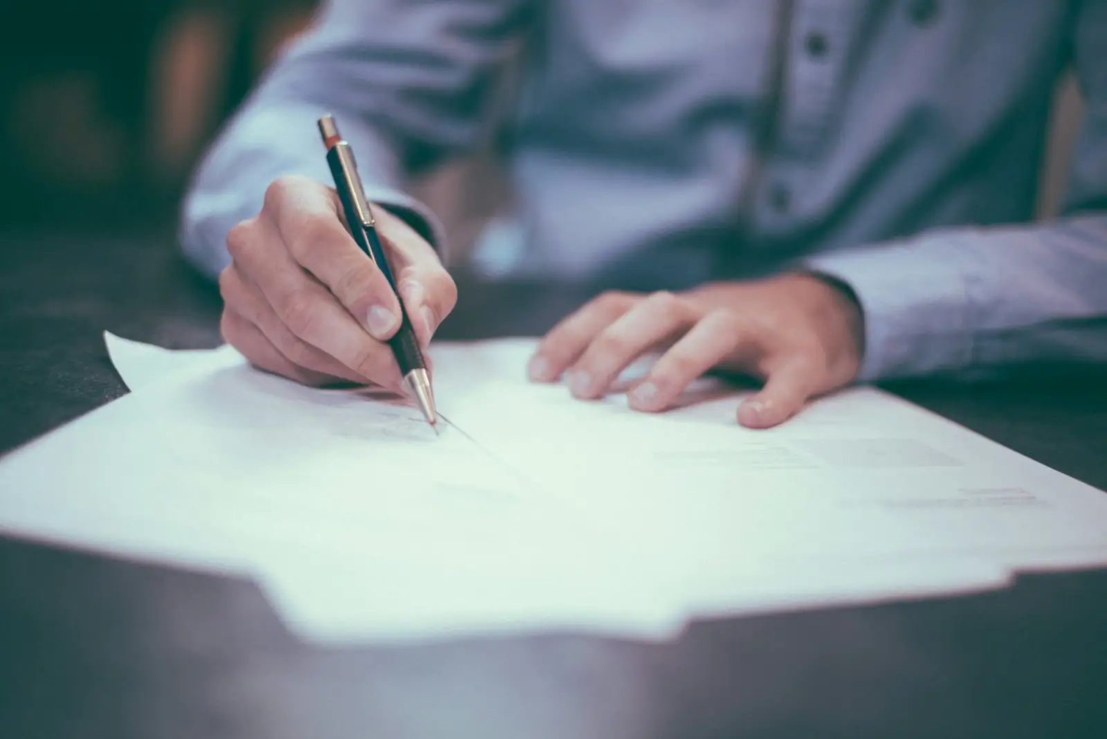 Business owner signing loan documents