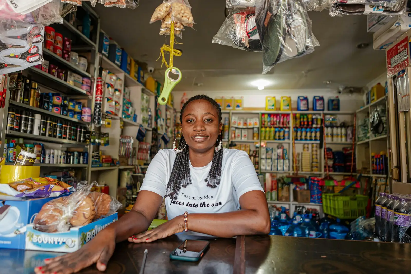 Small business owner behind the counter of her store